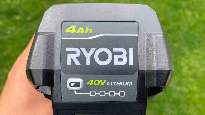 Person holding a Ryobi 40V battery