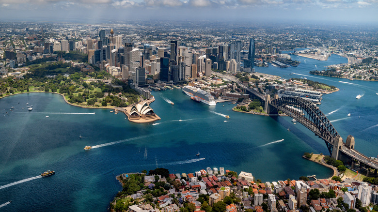 Aerial shot of Sydney Harbor showing the Opera House and the Harbor Bridge