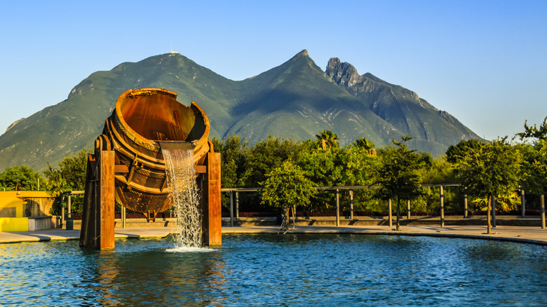 Mountain view with fountain in the foreground