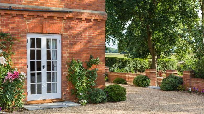 french door with brick wall