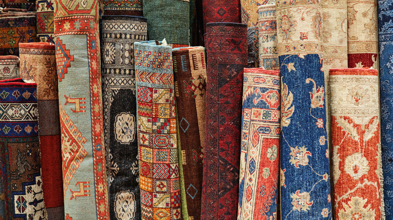 Collection of colorful rolled rugs