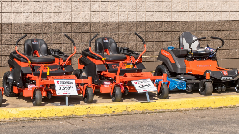 Row of riding lawn mowers for sale