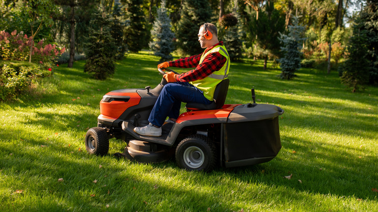 Man using a riding lawn mower