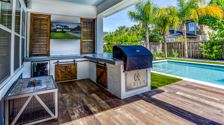 Outdoor kitchen next to pool