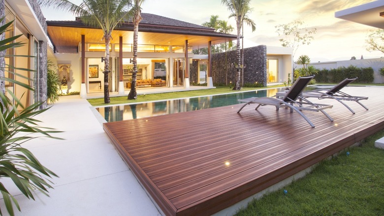 A modern home with a pool and deck