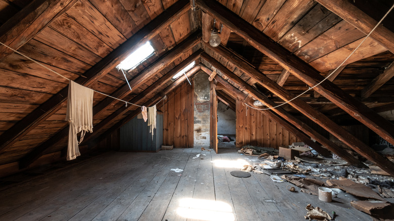 Unfinished attic with clutter