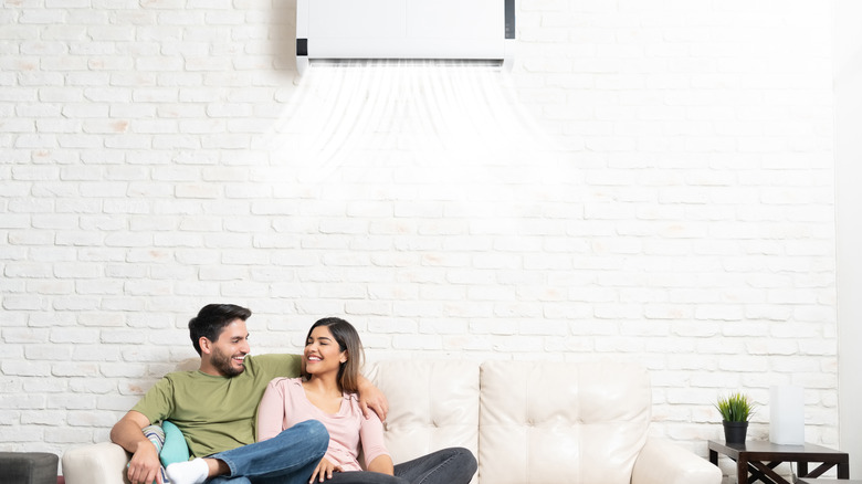 People sitting under AC