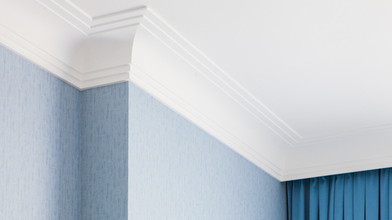 Crown molding over blue wall