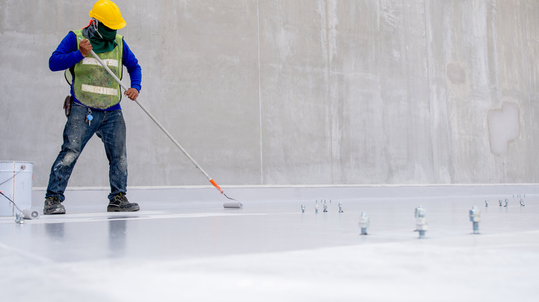 Worker polishing concrete floor