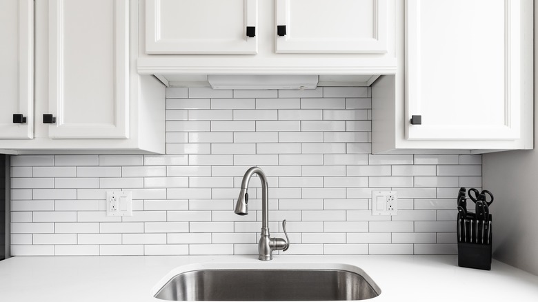 white cabinets over sink