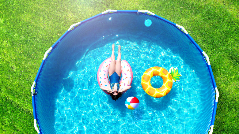 woman in above ground pool