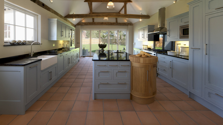 Kitchen with blue cabinets and tile