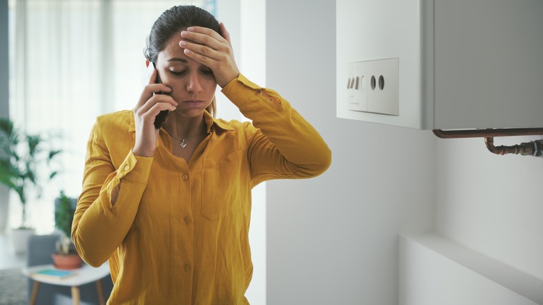 Woman on phone discussing boiler repair