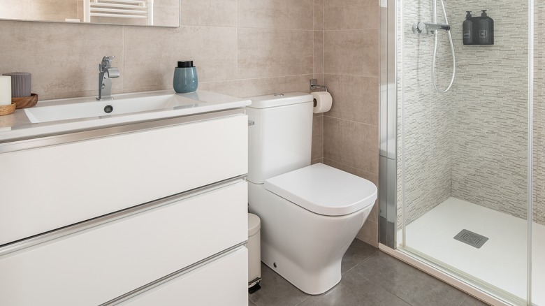 white toilet in beige bathroom