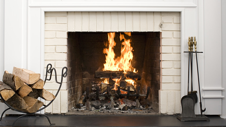 fireplace with lit logs