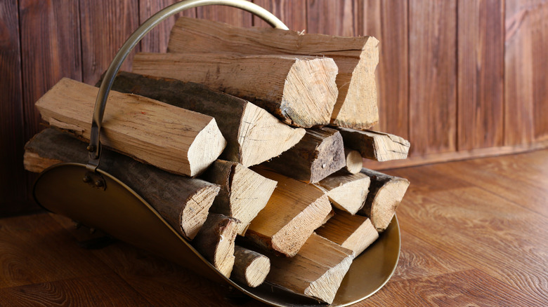 Bucket of firewood logs