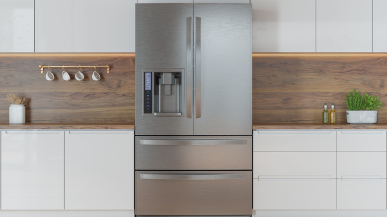 Clean kitchen with stainless steel refrigerator