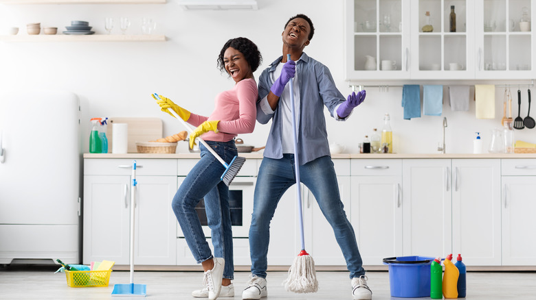 People singing while they mop