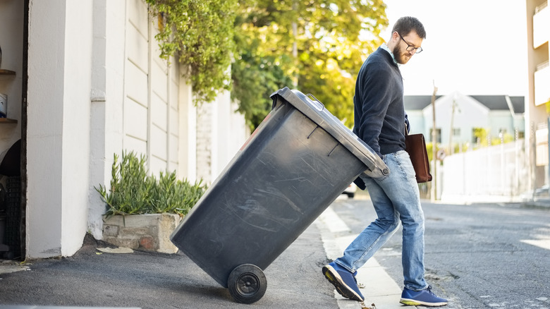 Man taking out garbage can