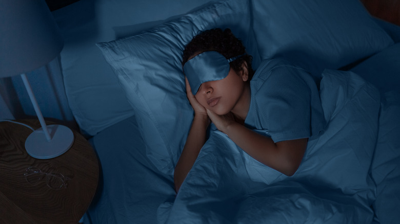 Woman sleeping comfortably on a bed