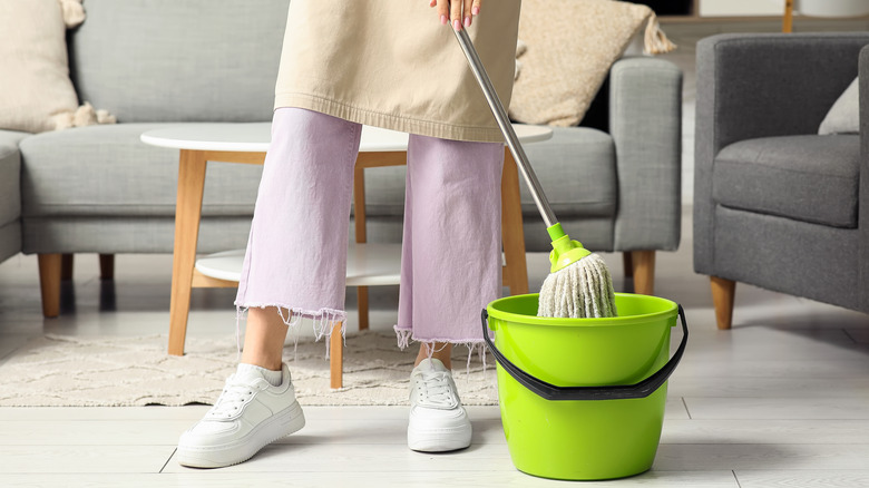 person mopping floor