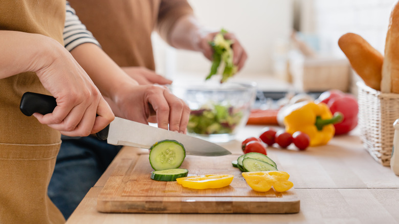 cutting produce on wooden board