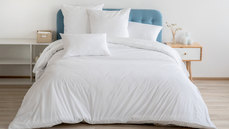 Interior with white bed linen on the sofa