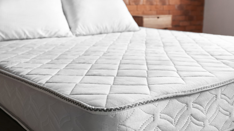 white mattress in bedroom