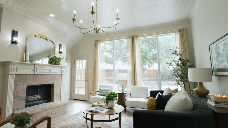 Sheer curtains on large window in living room