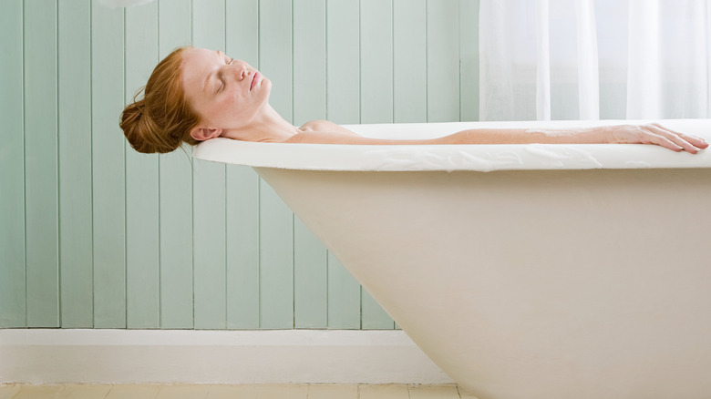 Woman relaxing in tub