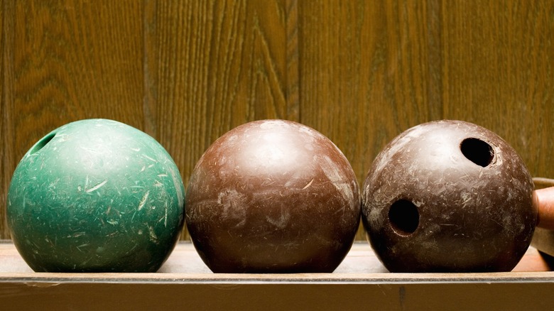 green and brown bowling balls