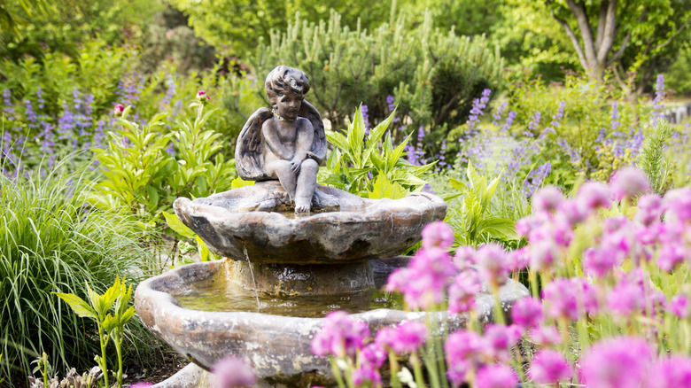 ornate garden with sculptural fountain
