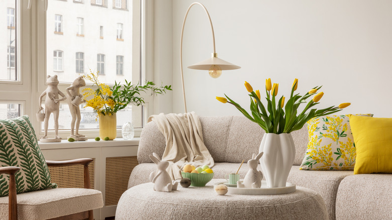 Neutral room with yellow tulips and yellow and green accents
