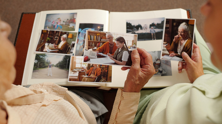A couple looking at a photo album full of memories