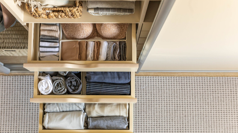 open organized drawers in closet wardrobe