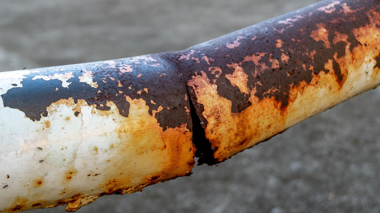 Rusty, broken galvanized steel pipe