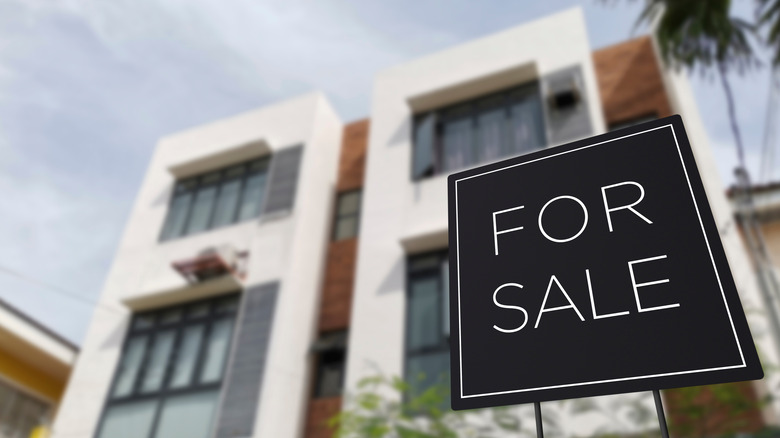 For sale sign by homes