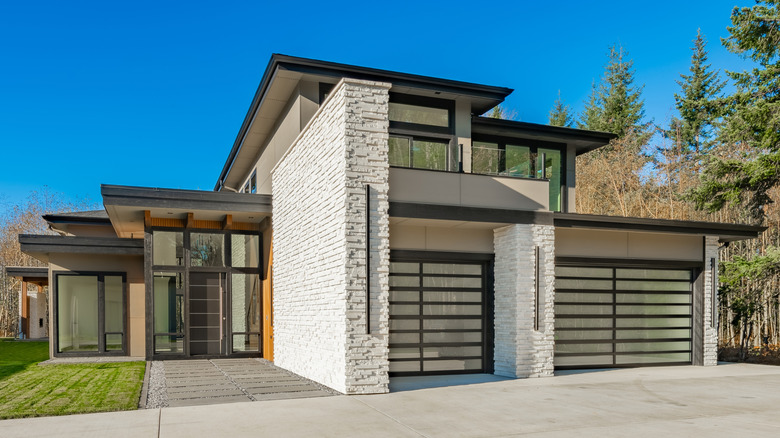 Modern house design with glass garage doors