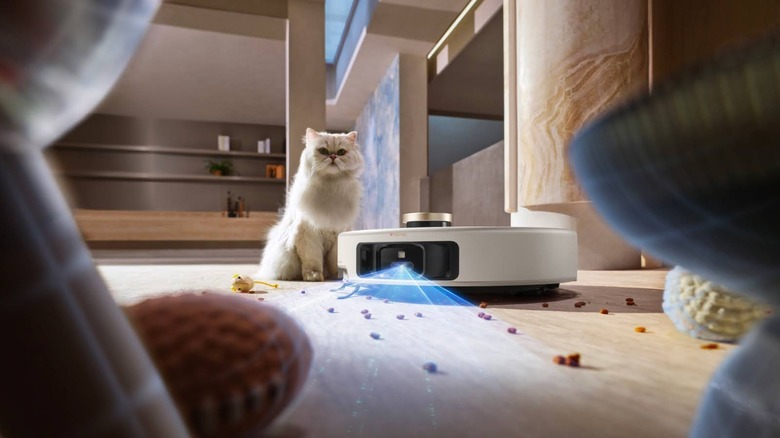 MOVA V50 Ultra robotic vacuum cleaner scanning floor near pet cat