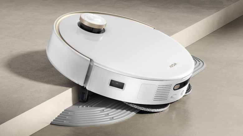 MOVA V50 Ultra robotic vacuum cleaner scanning floor near pet cat