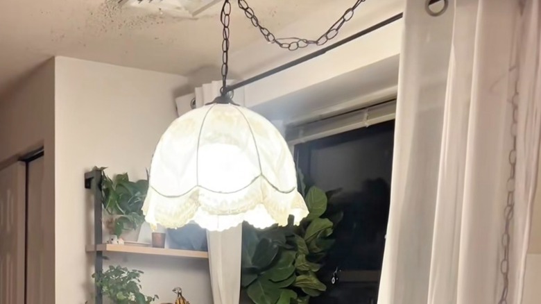 A ceiling lamp with a DIY lace lamp shade