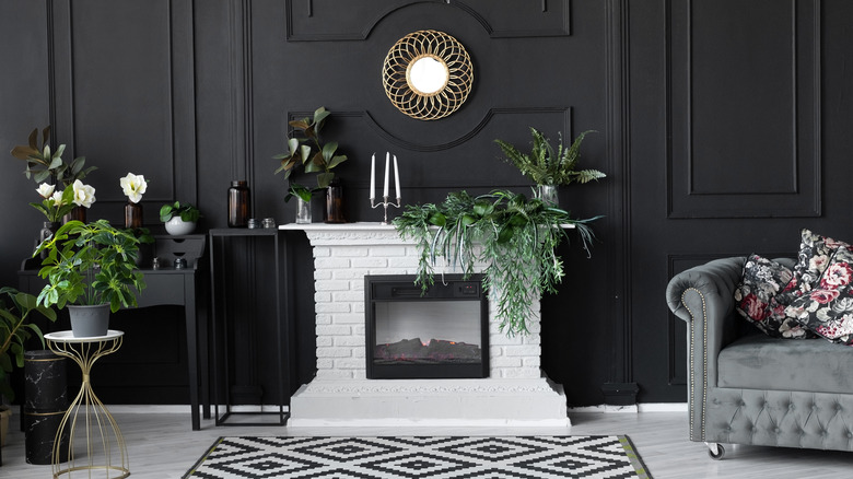 black accent wall with white fireplace