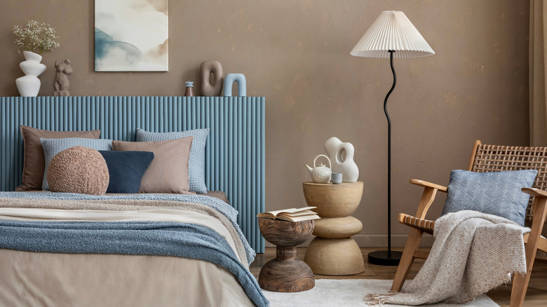 A beautifully staged, mismatched bed with lot's of texture and colorful detail