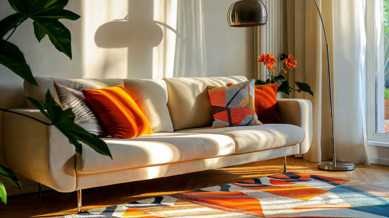 A living room with a brightly patterned rug