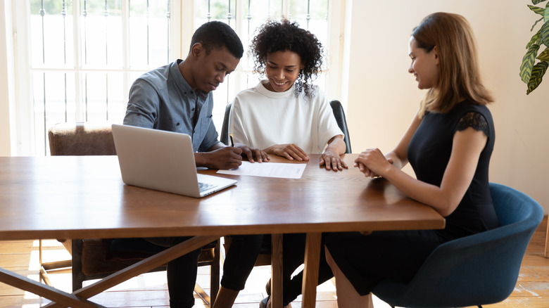 couple with real estate agent