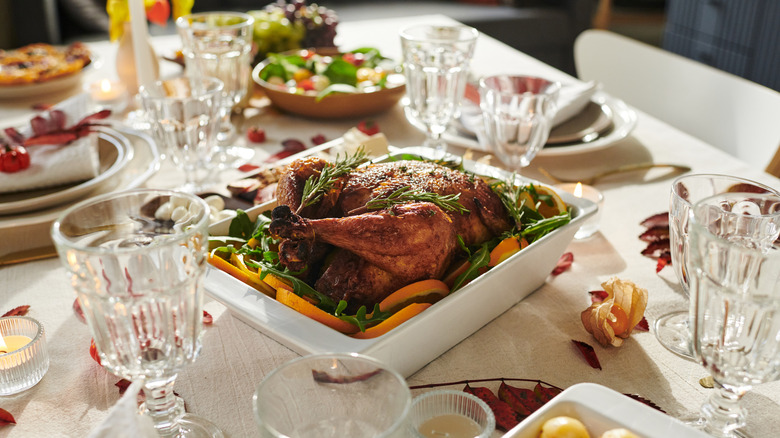 Thanksgiving dinner table with turkey and all the fixings