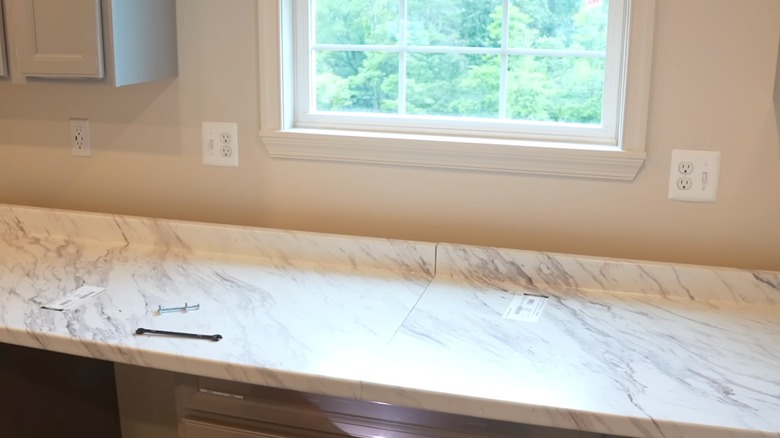 renovated kitchen with faux marble laminate counters
