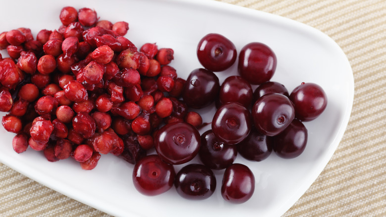 A bowl of cherries separated from their pits
