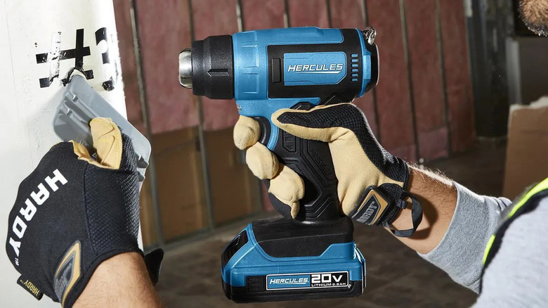 Peeling stickers off with Hercules cordless heat gun
