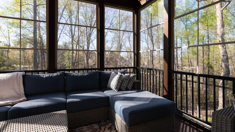 Screened in porch with furniture